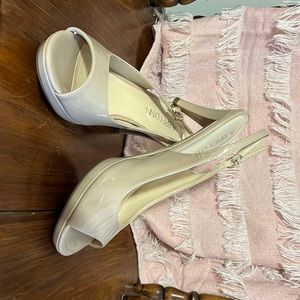 Tan, open toed, sling back, high heels. Wore in a wedding. Size 9.5